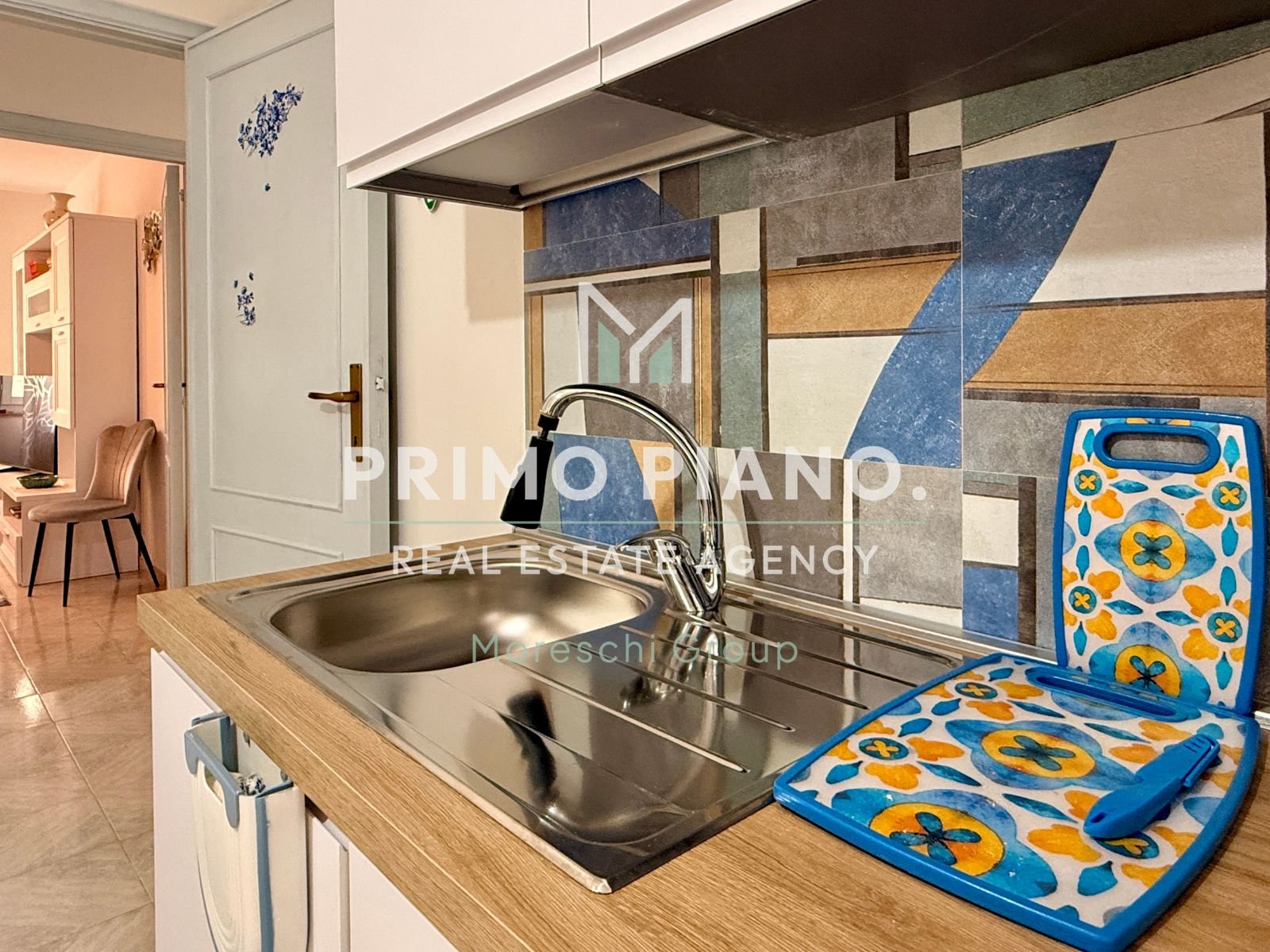 APPARTAMENTO CON DUE CAMERE E BOX AUTO IN ZONA CENTRALE