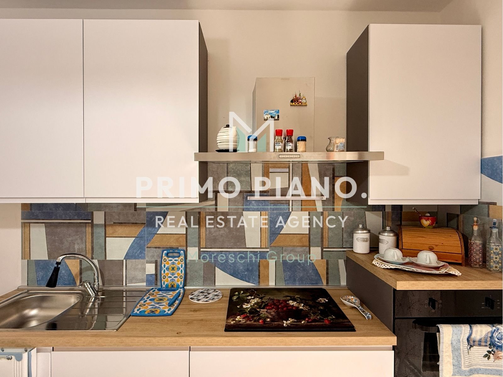 APPARTAMENTO CON DUE CAMERE E BOX AUTO IN ZONA CENTRALE