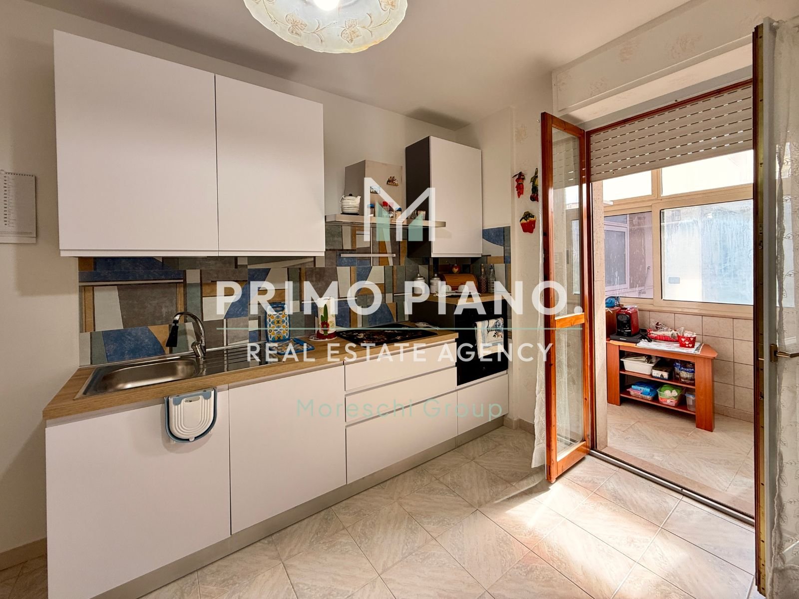 APPARTAMENTO CON DUE CAMERE E BOX AUTO IN ZONA CENTRALE